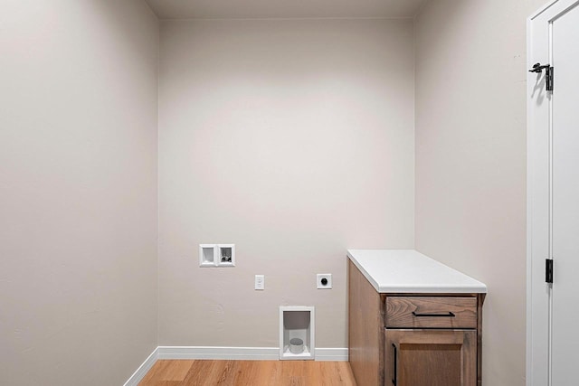 laundry room featuring light wood-type flooring, washer hookup, and electric dryer hookup