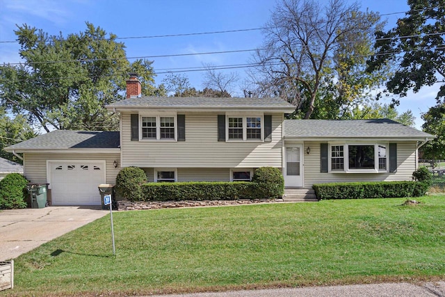 split level home with a garage and a front yard