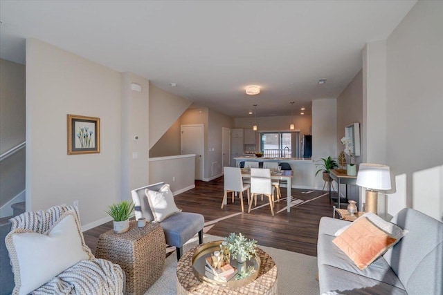 living room with baseboards and wood finished floors