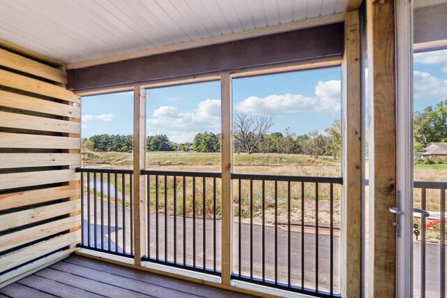 sunroom featuring a rural view