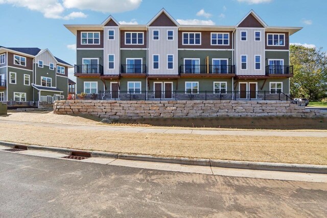 view of front of house with a balcony