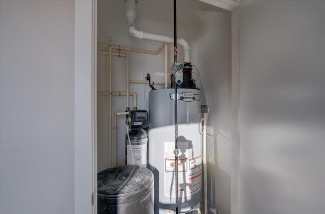utility room featuring water heater
