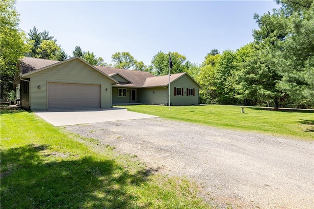 single story home featuring a front yard and a garage