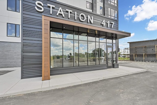 property entrance with brick siding