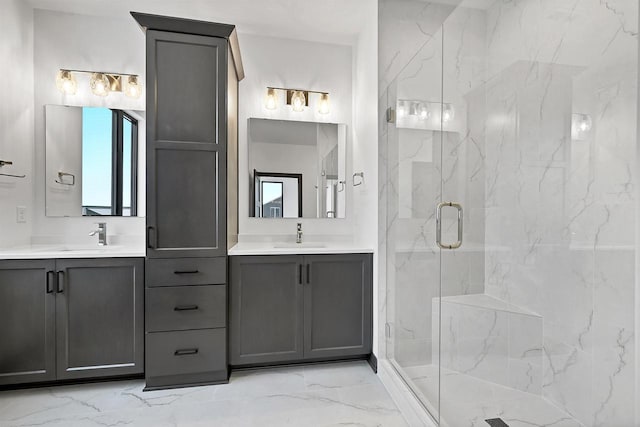 bathroom with marble finish floor, a marble finish shower, two vanities, and a sink