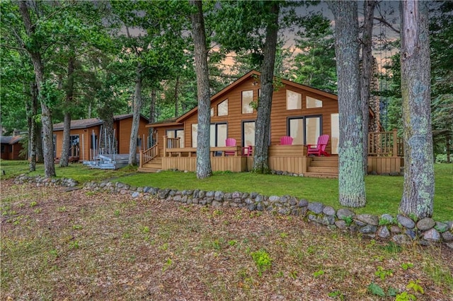 6874N Victory Heights Cir, Stone Lake, WI 54876 - rear view of property featuring a deck and a lawn