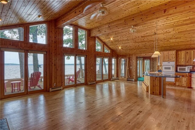 6874N Victory Heights Cir, Stone Lake, WI 54876 - unfurnished living room with high vaulted ceiling, a water view, wooden ceiling with exposed beams, light wood finished floors, and baseboard heating