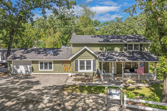 view of front of house featuring a garage and covered porch