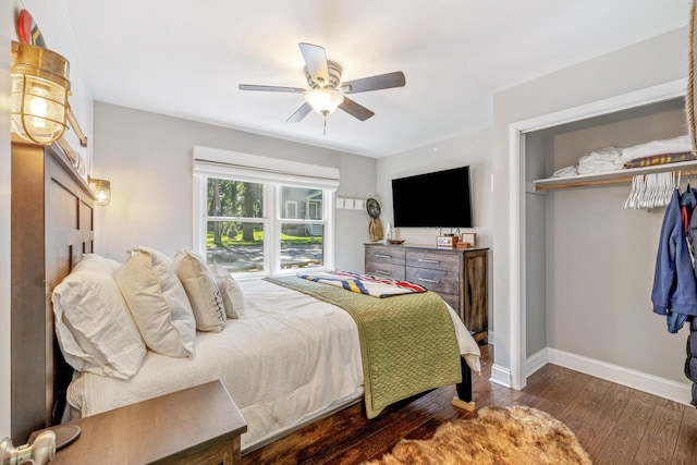 bedroom featuring ceiling fan and dark wood-type flooring