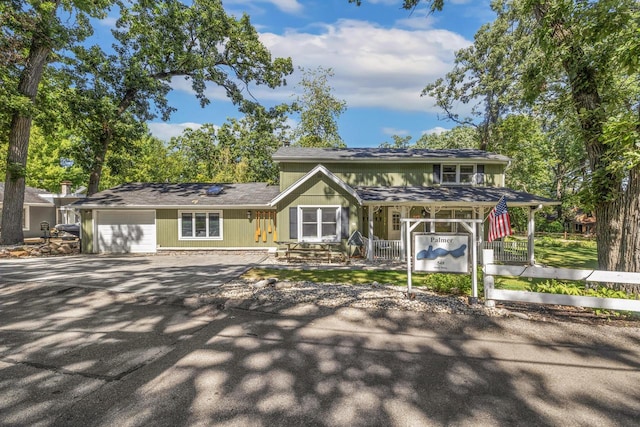 view of front of property with a garage and a porch