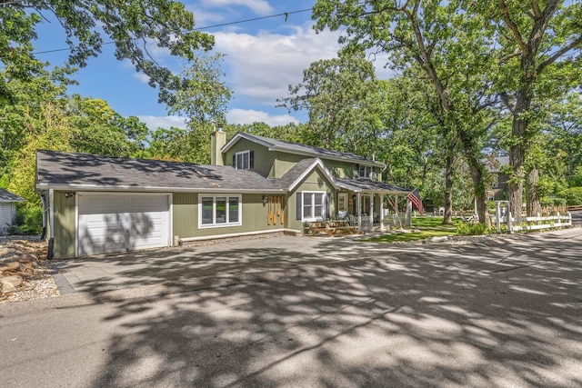 view of front of property with a garage