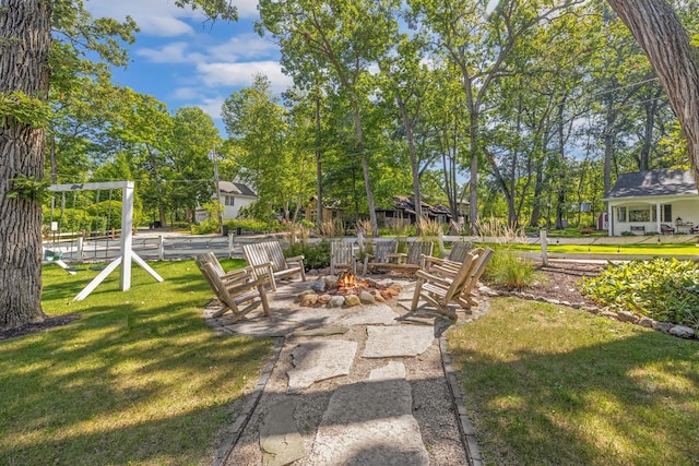 view of yard featuring an outdoor fire pit