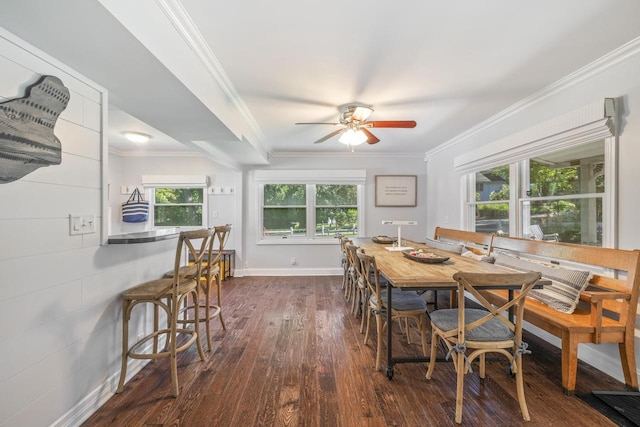 dining space featuring crown molding, ceiling fan, and dark hardwood / wood-style floors