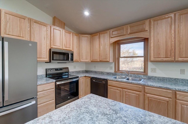 425 Mourning Dove Ct, Arena, WI 53503 - kitchen featuring appliances with stainless steel finishes, light brown cabinets, a sink, lofted ceiling, and recessed lighting