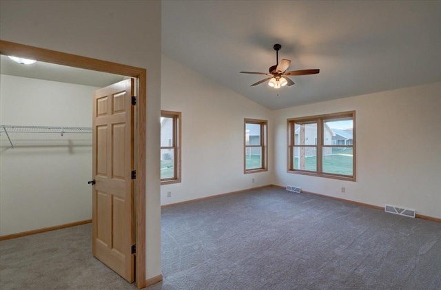 425 Mourning Dove Ct, Arena, WI 53503 - unfurnished bedroom with carpet, lofted ceiling, baseboards, and a walk in closet