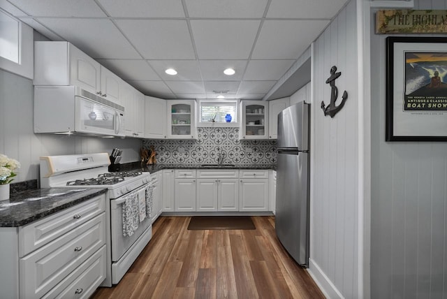 N1814 Highland Rd, Lake Geneva, WI 53147 - kitchen with white appliances, glass insert cabinets, a paneled ceiling, dark wood-style floors, and a sink