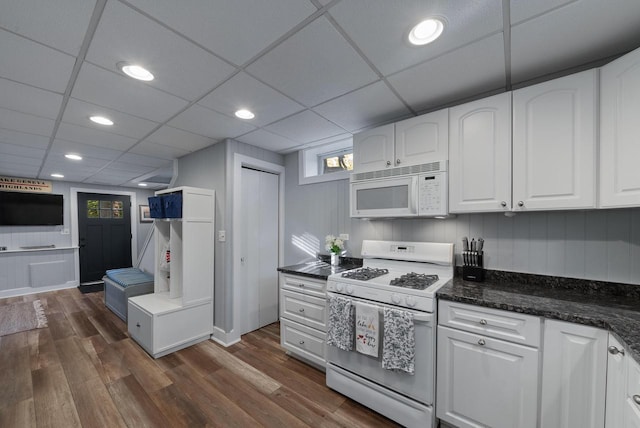 N1814 Highland Rd, Lake Geneva, WI 53147 - kitchen with white appliances, white cabinets, dark wood-type flooring, recessed lighting, and dark stone counters