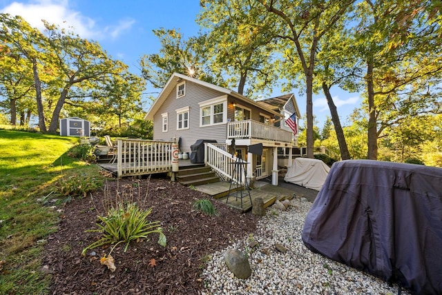 N1814 Highland Rd, Lake Geneva, WI 53147 - view of property exterior featuring a deck and a lawn
