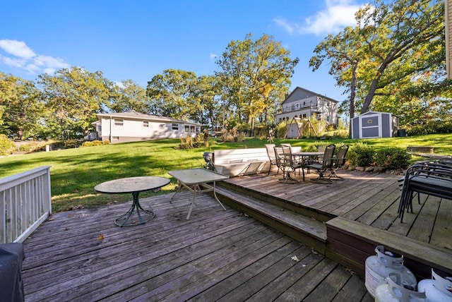 N1814 Highland Rd, Lake Geneva, WI 53147 - wooden deck featuring outdoor dining area and a lawn
