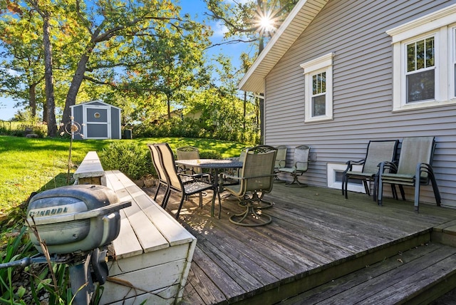 N1814 Highland Rd, Lake Geneva, WI 53147 - wooden terrace featuring outdoor dining area and a lawn