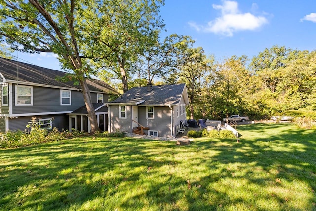 N1814 Highland Rd, Lake Geneva, WI 53147 - back of property with a yard and entry steps