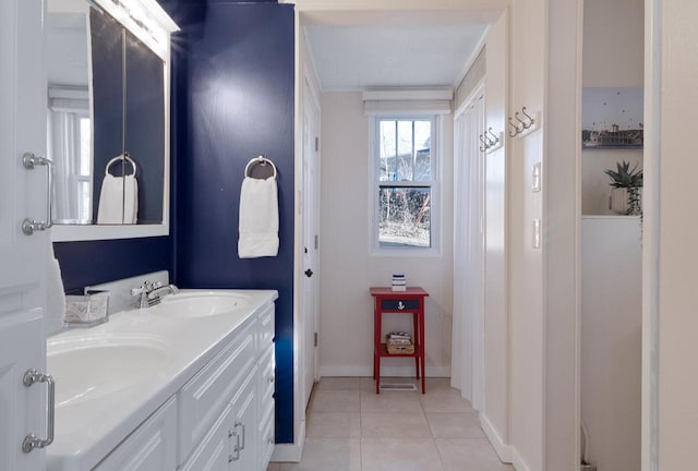 N1814 Highland Rd, Lake Geneva, WI 53147 - bathroom featuring double vanity, tile patterned flooring, and baseboards