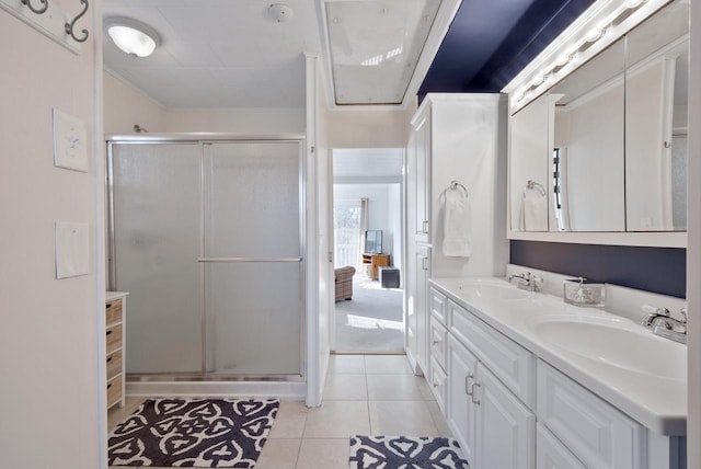 N1814 Highland Rd, Lake Geneva, WI 53147 - bathroom with double vanity, a stall shower, tile patterned floors, and ornamental molding