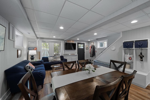 N1814 Highland Rd, Lake Geneva, WI 53147 - dining space featuring light wood-style flooring, plenty of natural light, stairs, recessed lighting, and a drop ceiling