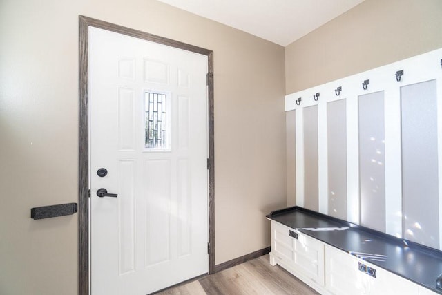 mudroom with light hardwood / wood-style floors