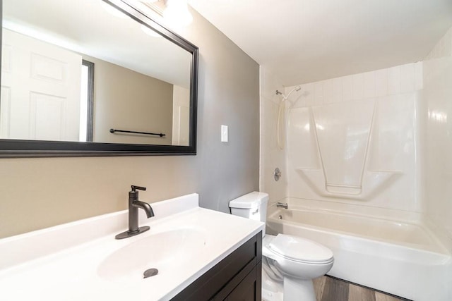 full bathroom with shower / bathtub combination, hardwood / wood-style flooring, vanity, and toilet