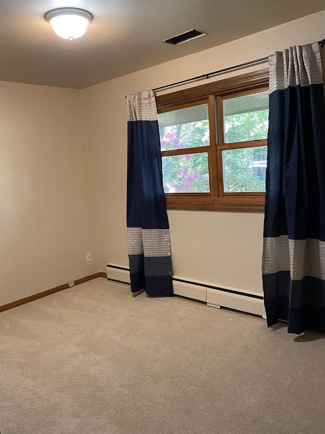 spare room with light carpet