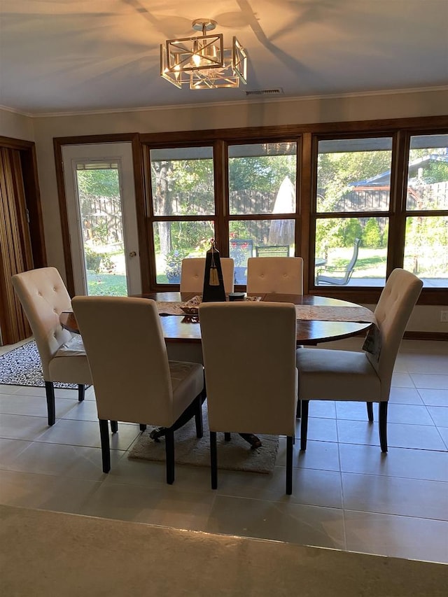 tiled dining area with crown molding