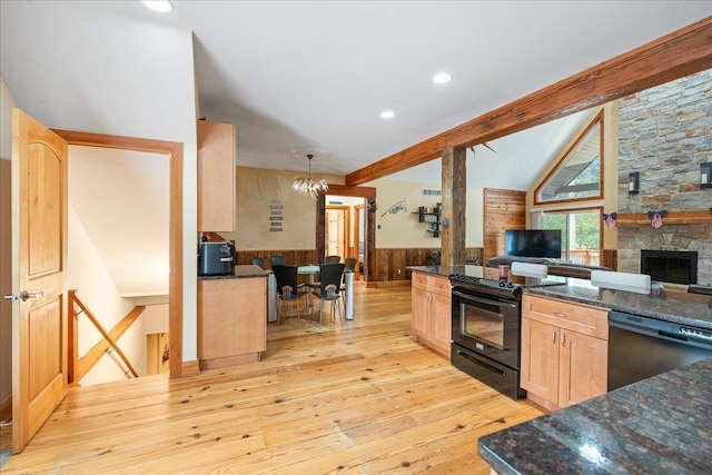 kitchen with light hardwood / wood-style floors, pendant lighting, light brown cabinetry, black electric range oven, and stainless steel dishwasher