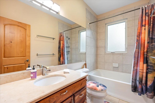 full bathroom featuring vanity, tile patterned flooring, toilet, and shower / bath combo