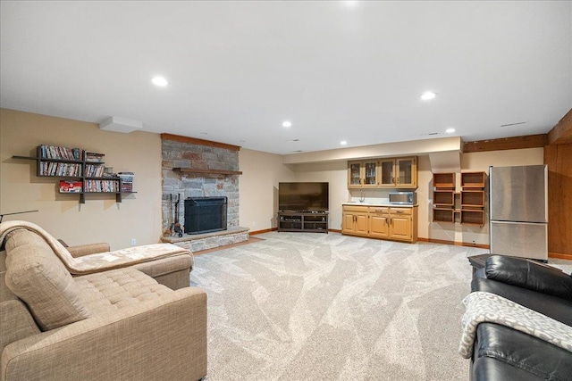 carpeted living room featuring a fireplace