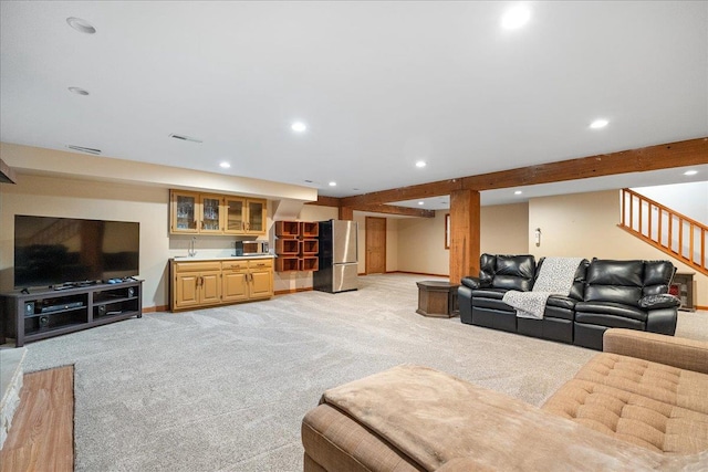 living room featuring light colored carpet and beam ceiling