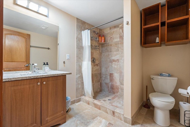 bathroom with a shower with curtain, vanity, and toilet