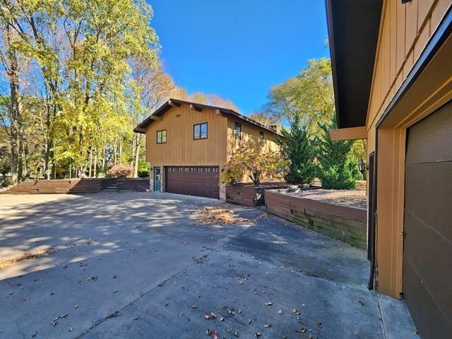 view of property exterior with a garage