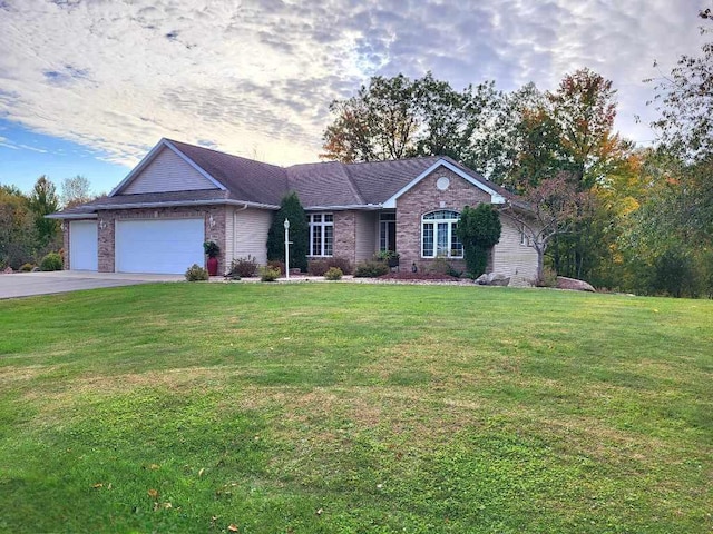 ranch-style house with a garage and a yard