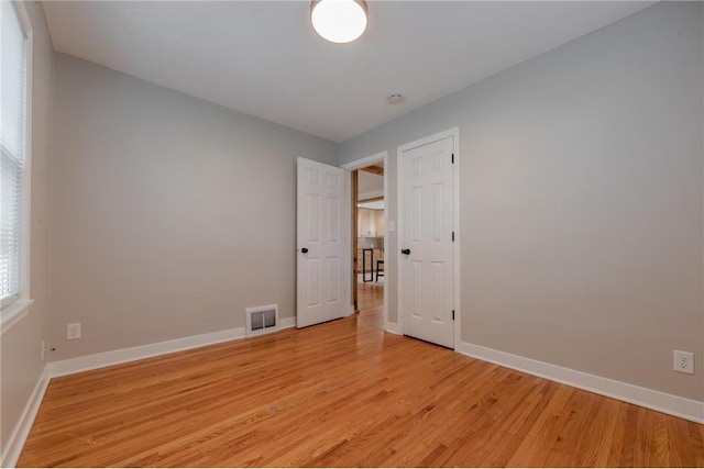 empty room with light wood-type flooring