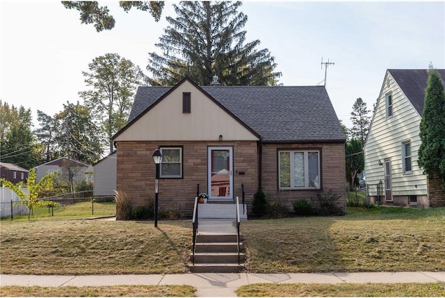 bungalow-style house featuring a front yard