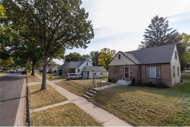 bungalow-style house with a garage and a front yard