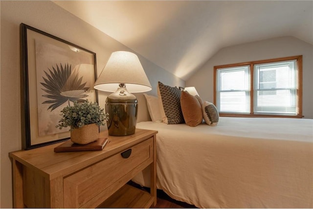 bedroom featuring lofted ceiling