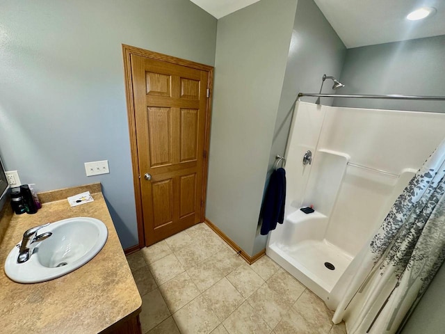 bathroom featuring vanity, curtained shower, and tile patterned floors