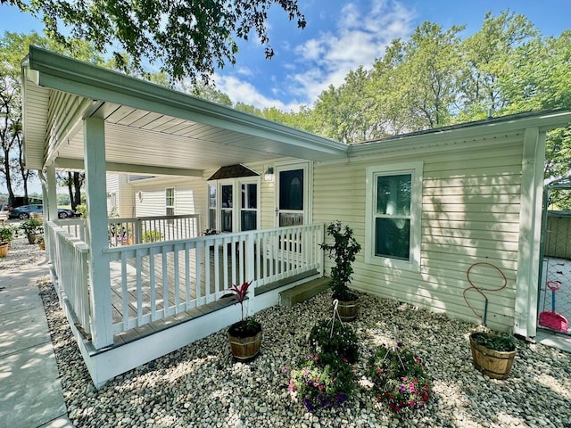 back of house featuring a deck