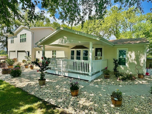 rear view of house with a garage