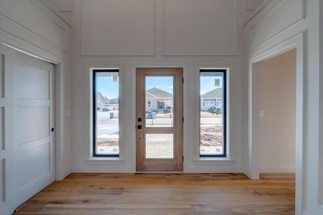 1438 Greenleaf Ct, Sun Prairie, WI 53590 - doorway to outside with light wood-style flooring and baseboards