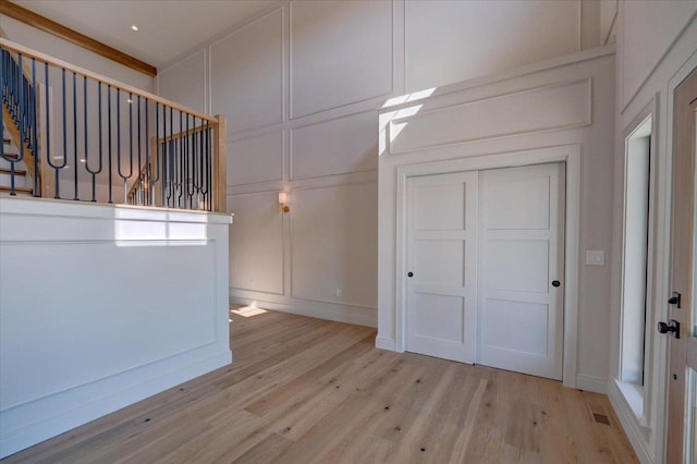 1438 Greenleaf Ct, Sun Prairie, WI 53590 - interior space with a decorative wall, light wood-type flooring, and stairway