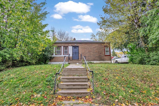 4470 N 37th St, Milwaukee, WI 53209 - view of front facade with a front yard and a chimney
