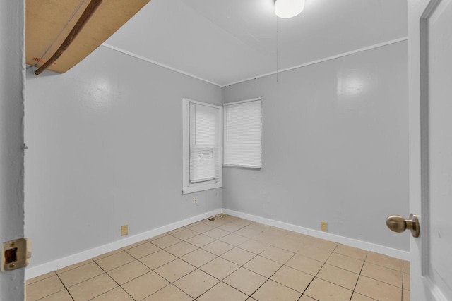 spare room featuring light tile patterned floors